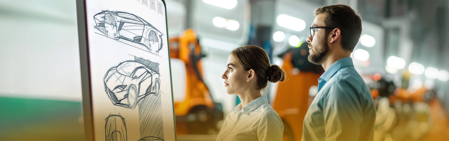 Future vision of the automotive industry: A woman and a man are looking at a screen showing sketches of futuristic cars.