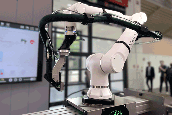 Gluing complex parts with robots | Robatech