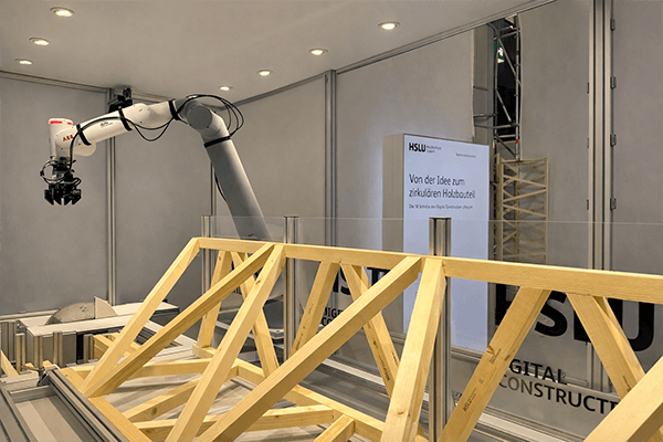 Robots glue timber components at Swissbau | Robatech 